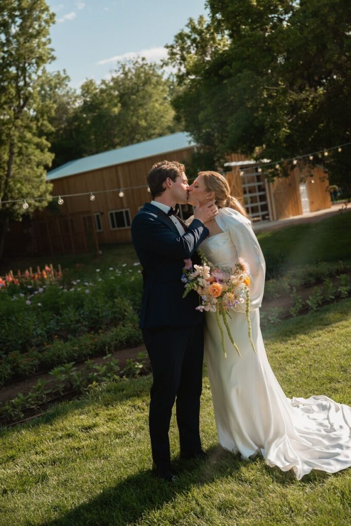Bride and groom kissing at Lyons Farmette, a micro wedding venue in Colorado