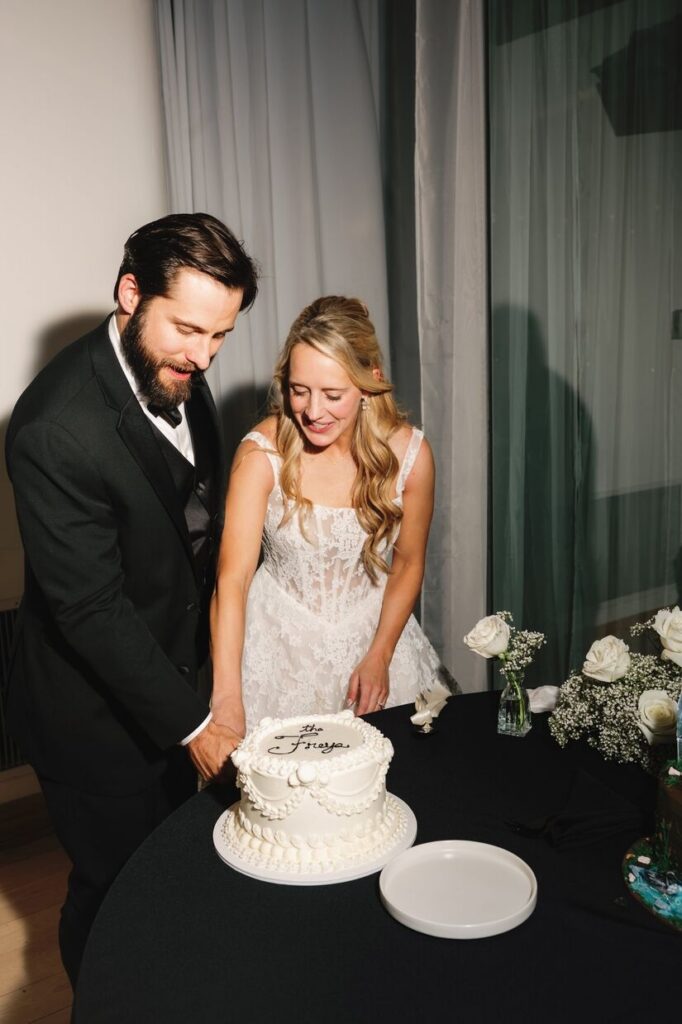 Couple cutting their cake at Rembrandt Yard, a micro wedding venue in Colorado