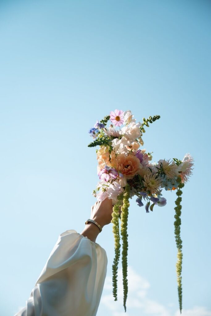 Bride holding a bouquet of flowers from Lyons Farmette, a micro wedding venue in Colorado