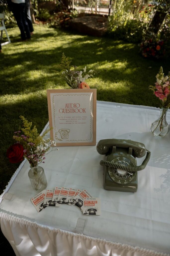 An audio guestbook sign with an old phone sitting on a table at a micro wedding venue in Colorado