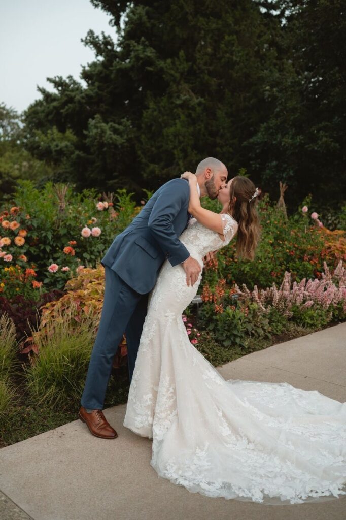 Groom dipping bride for kiss at an intimate wedding venue in Colorado